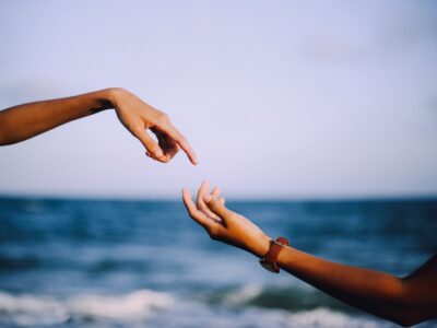 two person holding hands photograph